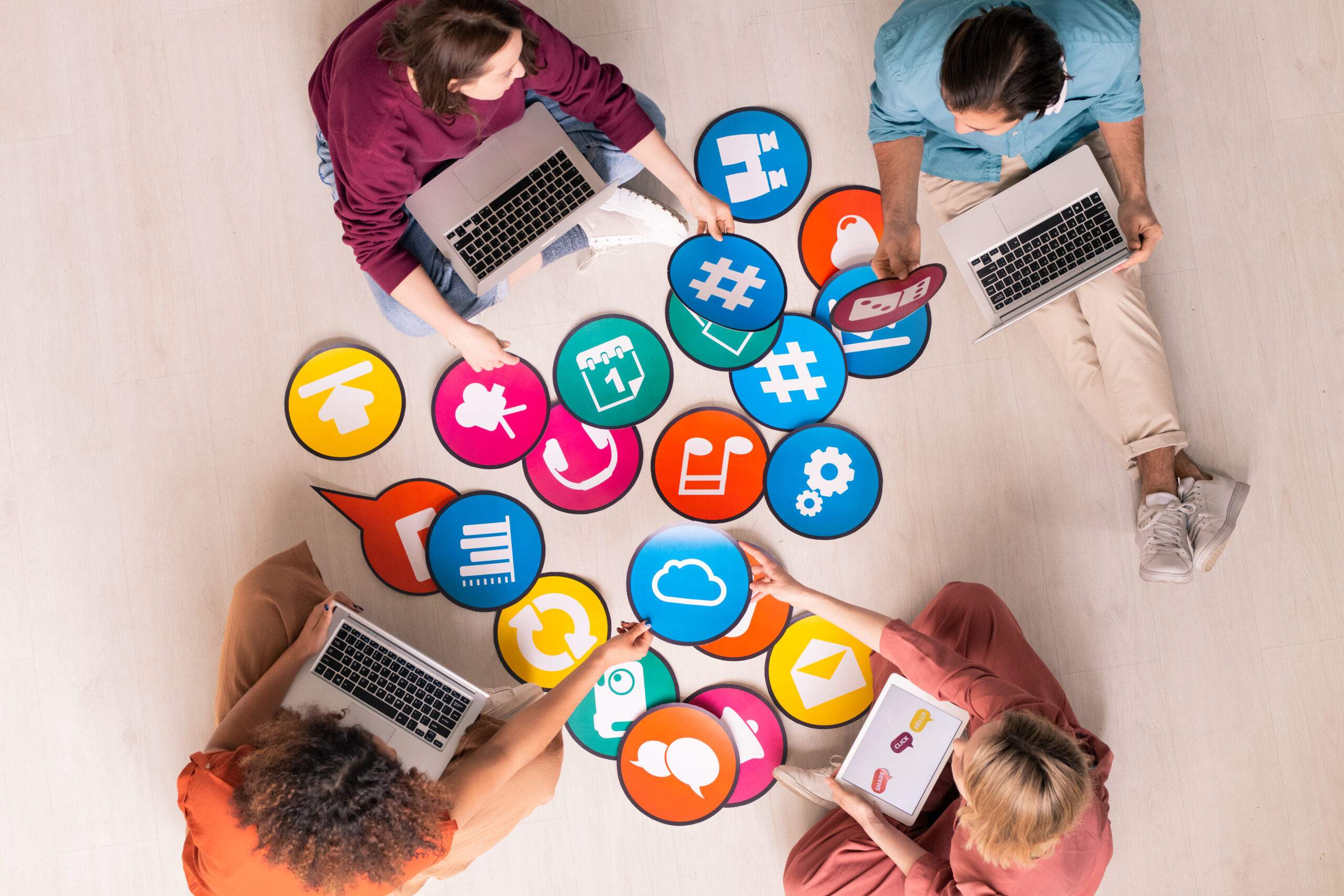 Top-down view of a collaborative team brainstorming engagement strategies for Social Media Marketing in Durango, CO.