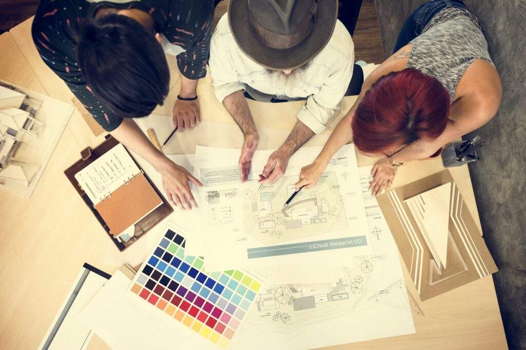 Top-down view of the creative team sketching custom concepts for Graphic Design in Durango, CO.