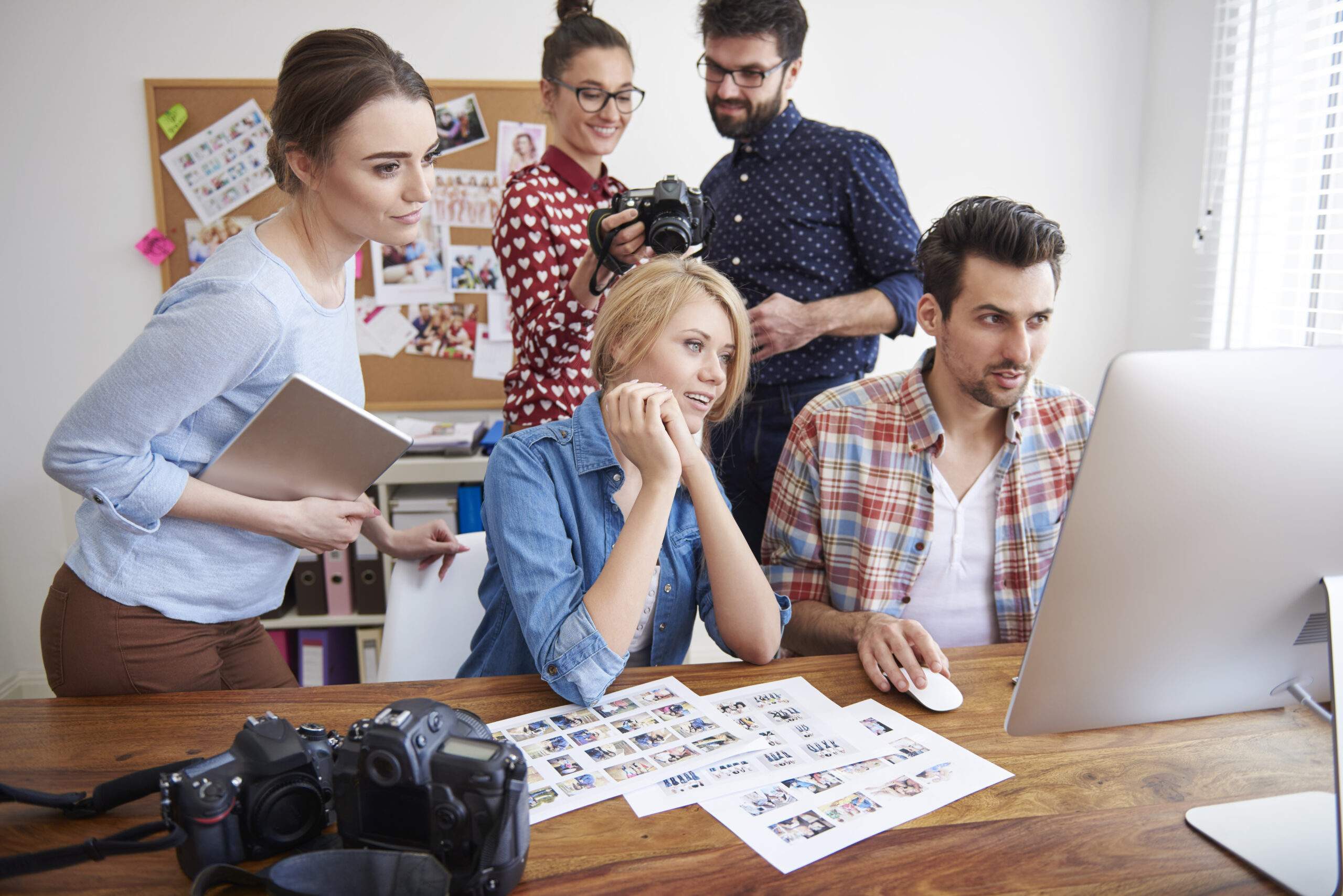Collaborative team review of digital branding and print concepts for Graphic Design in Durango, CO.